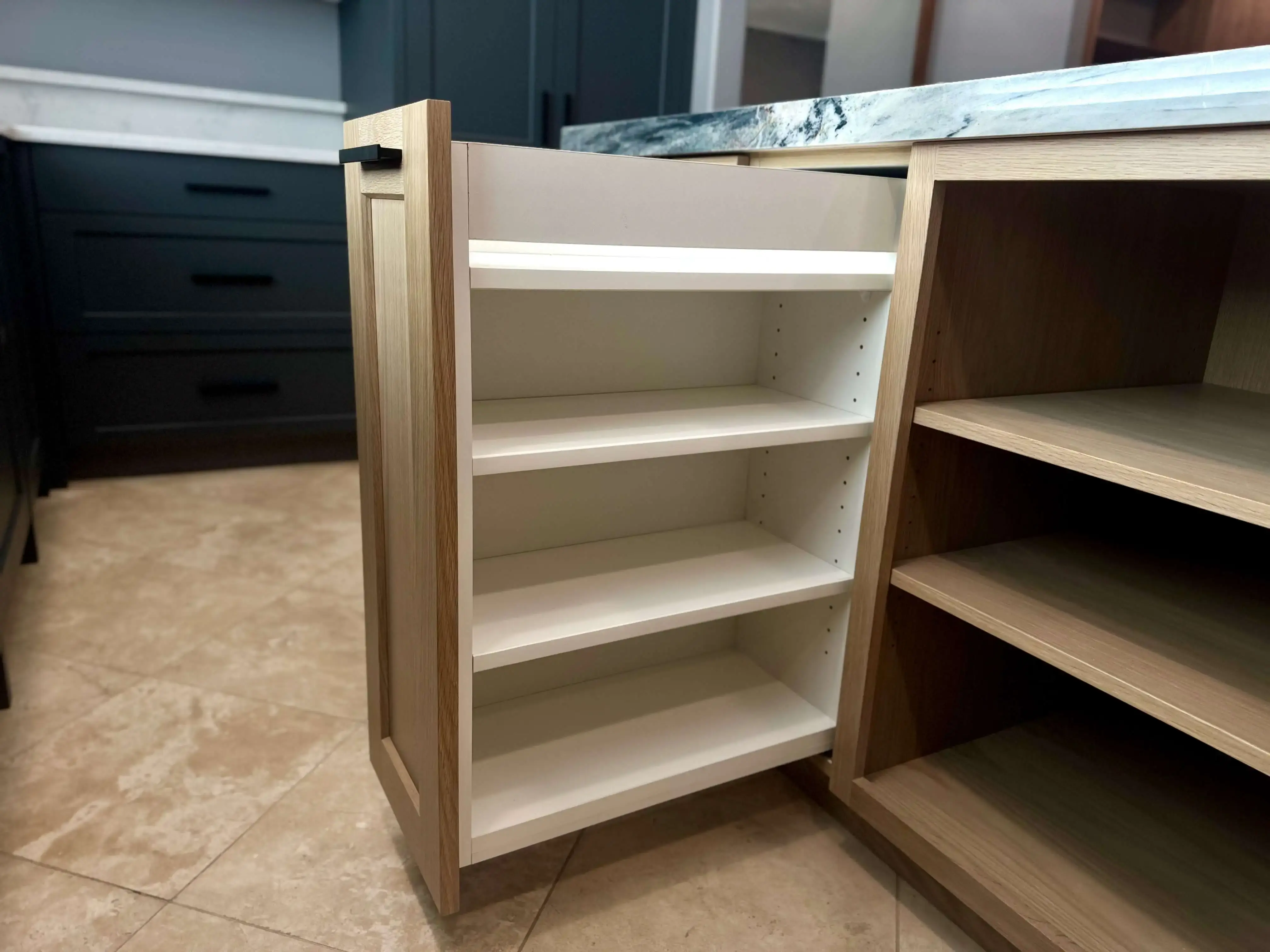Finished custom cabinetry installation showcasing fine joinery, wood grain detail, and hand-finished craftsmanship by a luxury cabinet shop.
